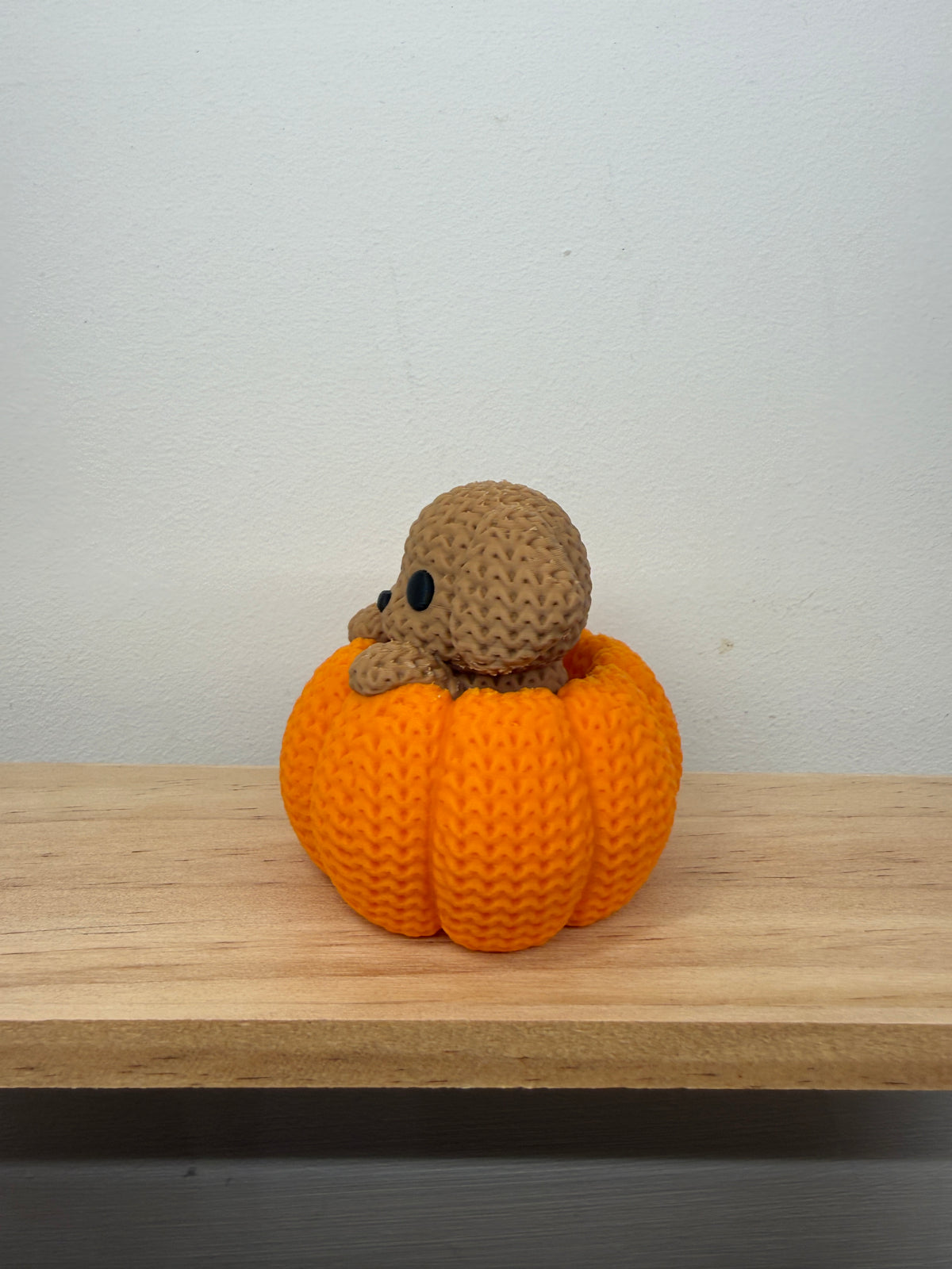 Dog in a Pumpkin Figurine