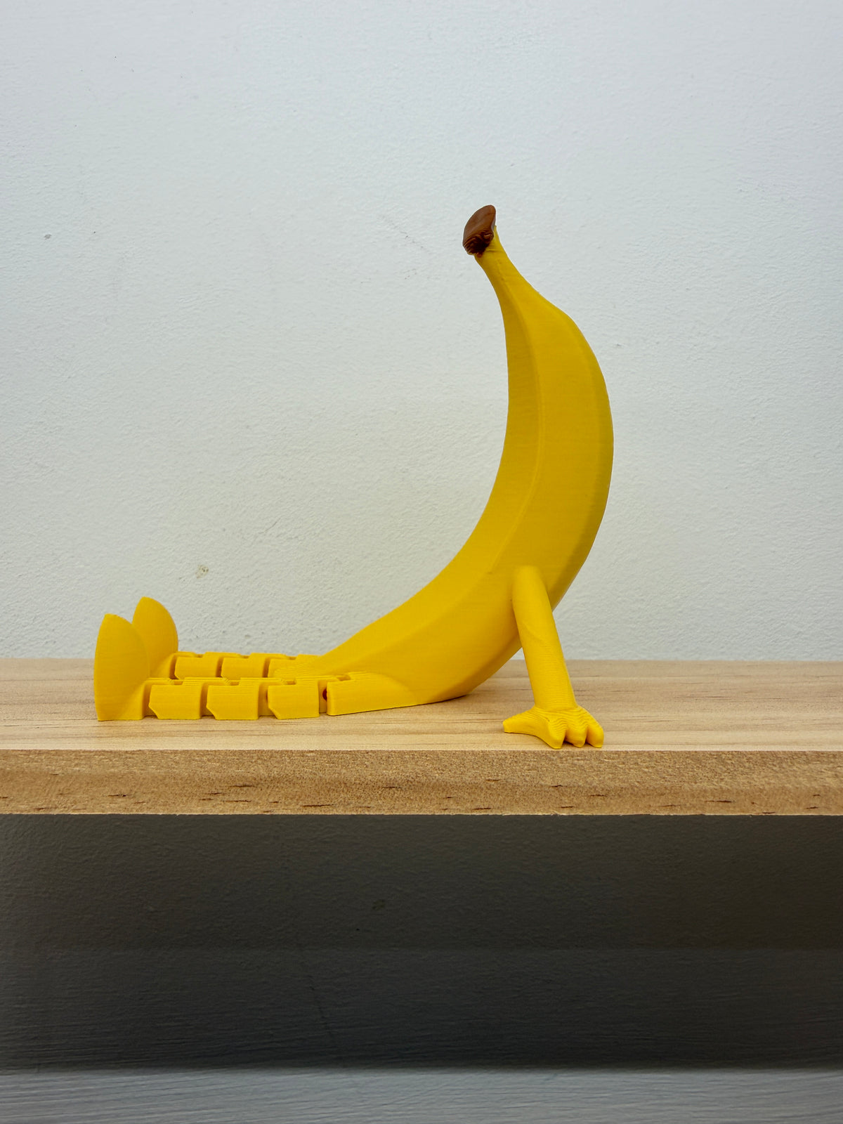 Banana Shelf Sitter with Dangling Legs