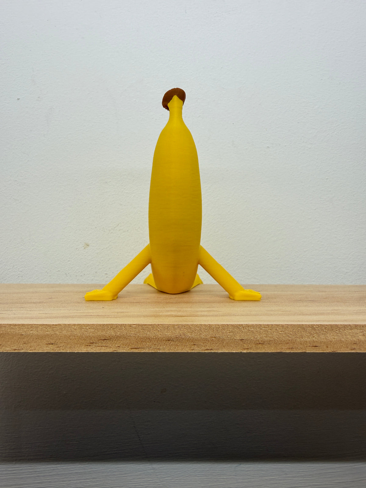 Banana Shelf Sitter with Dangling Legs