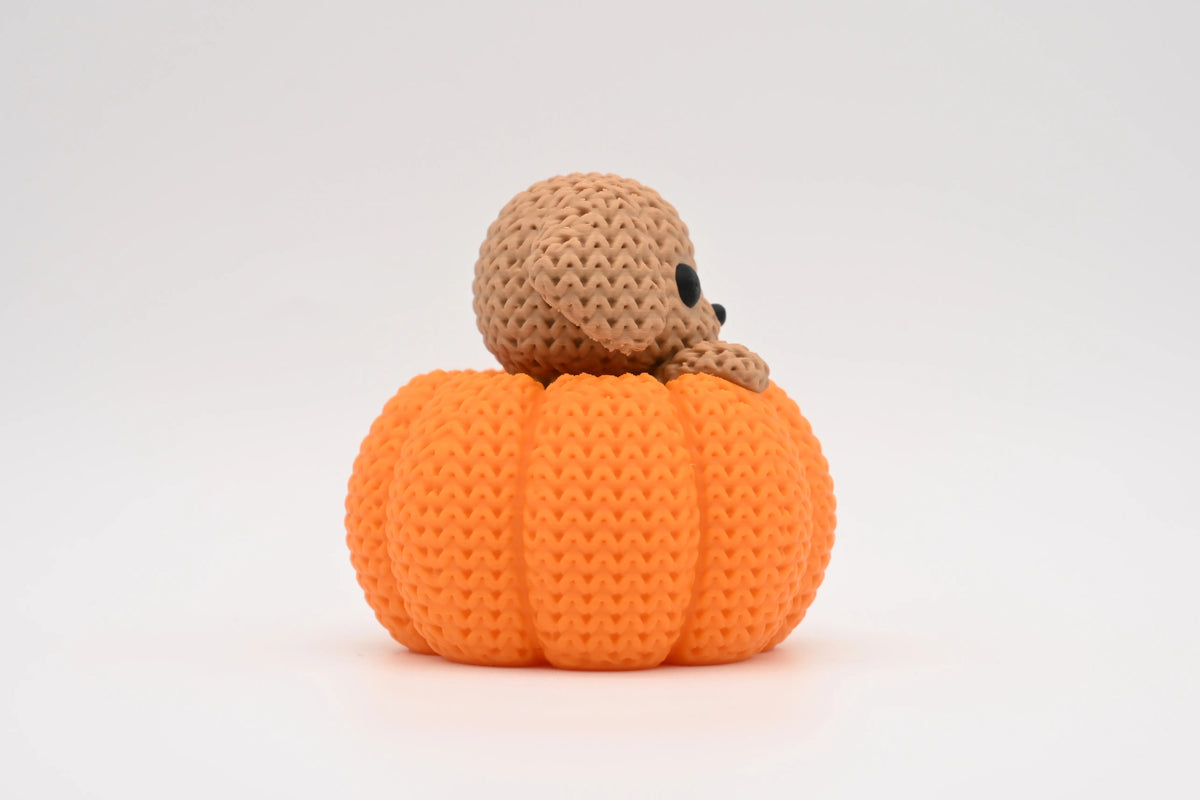 Dog in a Pumpkin Figurine